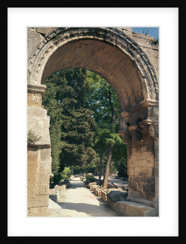 View of the Allee de Sarcophages through the remains of the entrance of the Church of St. Cesaire le Vieux by Anonymous