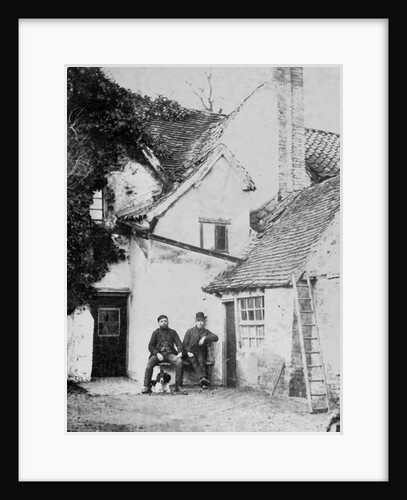 Two men outside Enfield cottage, c.1890 by English Photographer