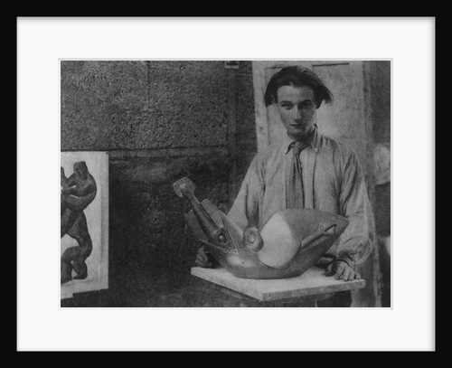 Henri Gaudier-Brzeska with his sculpture 'Bird Swallowing Fish' in Kettle's Yard, University of Cambridge, 1914 by English Photographer