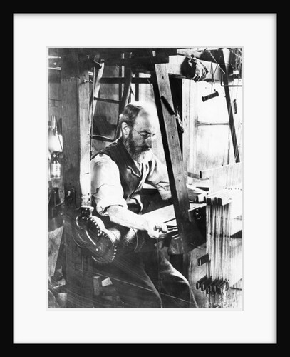 Man working at a handloom by English Photographer