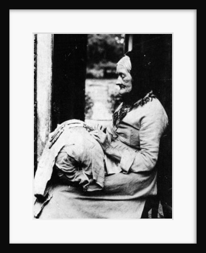 A lace maker outside her cottage in South Buckinghamshire, late C19th by English Photographer