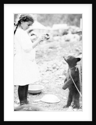 Girl and bear cub, c.1900-16 by Anonymous