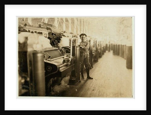 Boy sweeper by carding machines at Lincoln Cotton Mills, Evansville, Indiana in stockinged feet on a slippery floor, 1908 by Lewis Wickes Hine