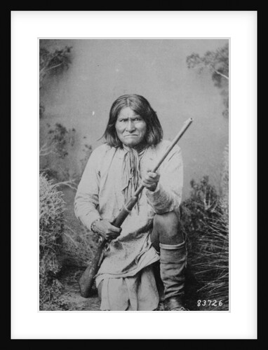 Geronimo holding a rifle, 1884 by American Photographer