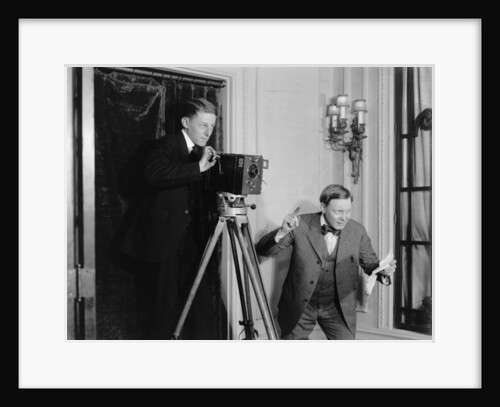 Two men using a movie camera indoors, c.1908-20 by Detroit Publishing Co.