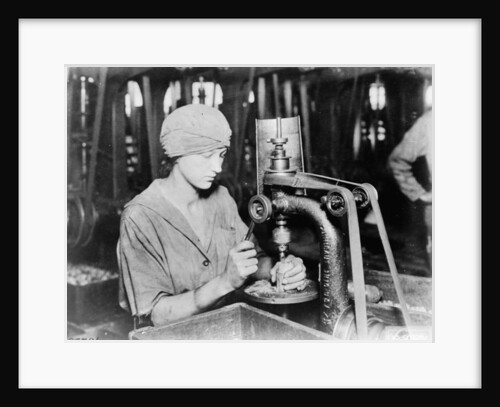 Woman countersinking detonator tube hole and filling hole in hand grenade at Westinghouse Electric & Mfg. Co., East Pittsburgh, Pa., during World War I, 1914-18 by American Photographer