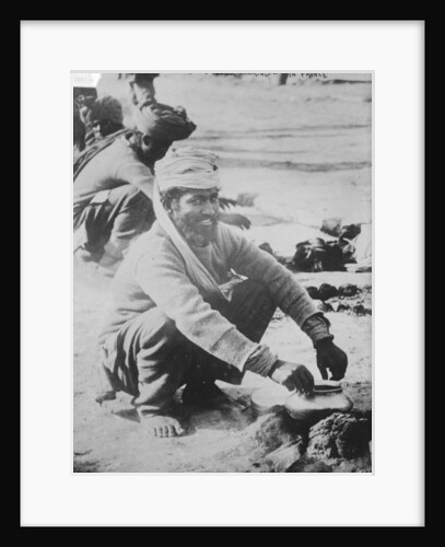 Indian soldier cooking in France, 1914-15 by French Photographer