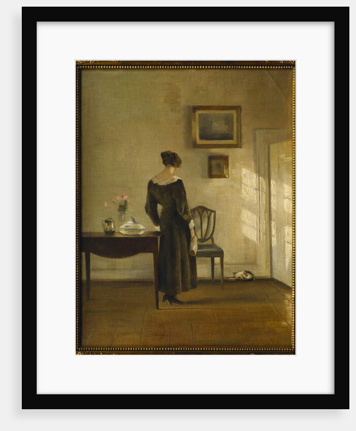 An Interior with a Woman feeding a Cat by Carl Holsoe
