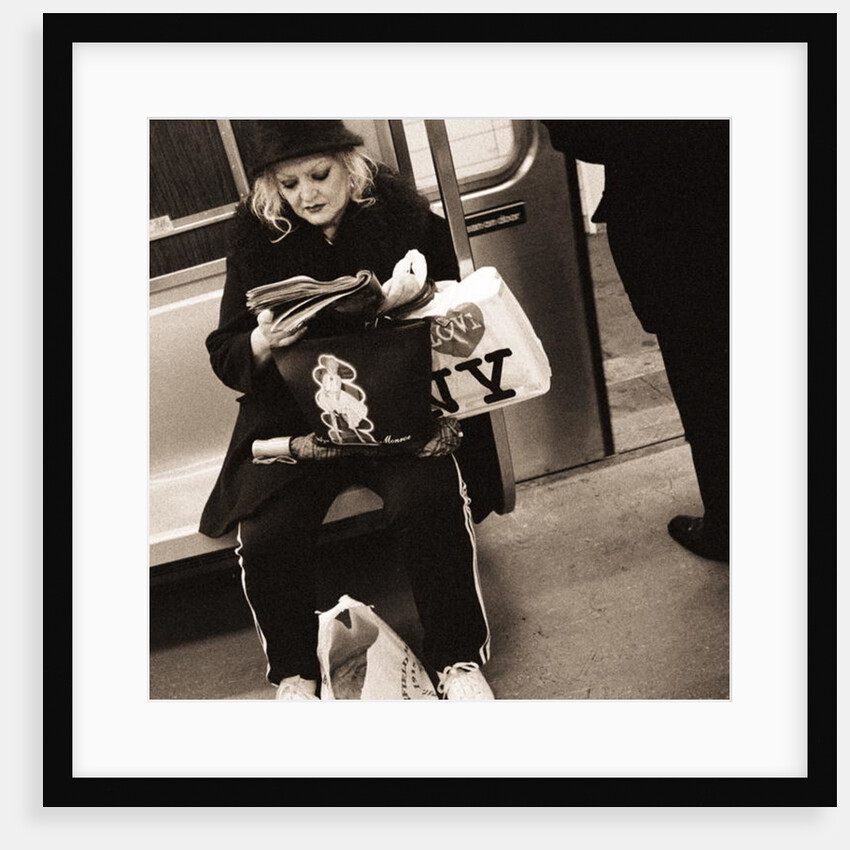 Woman reading on a subway with a Marilyn Monroe purse and an 'I Love New York' bag, 2004 by Anonymous