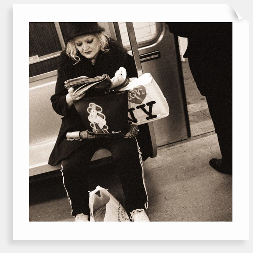 Woman reading on a subway with a Marilyn Monroe purse and an 'I Love New York' bag, 2004 by Anonymous