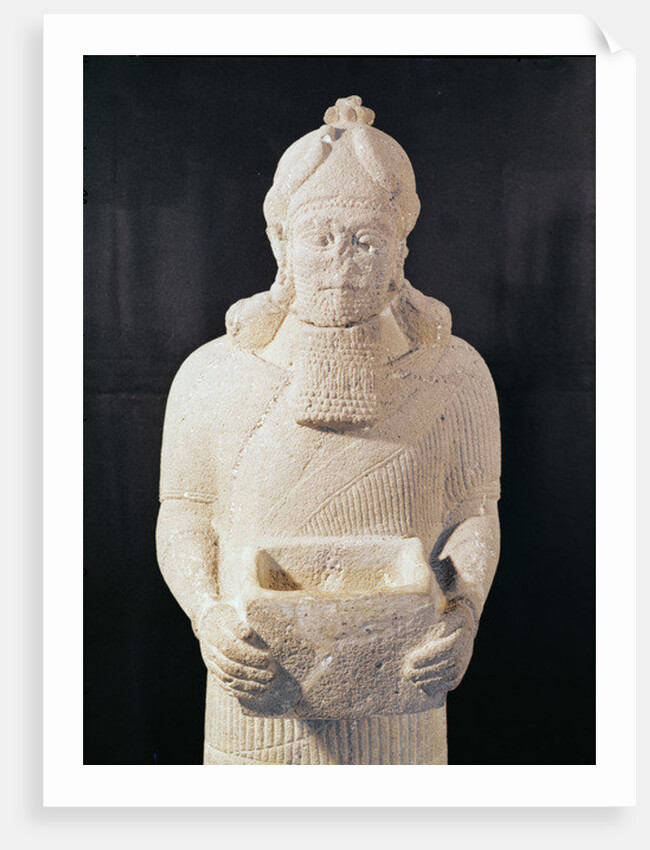 Statuette of a man carrying a box by Assyrian