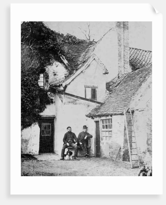 Two men outside Enfield cottage, c.1890 by English Photographer