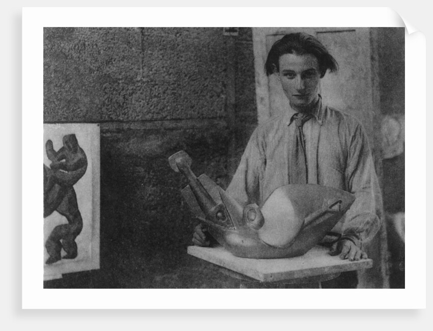 Henri Gaudier-Brzeska with his sculpture 'Bird Swallowing Fish' in Kettle's Yard, University of Cambridge, 1914 by English Photographer