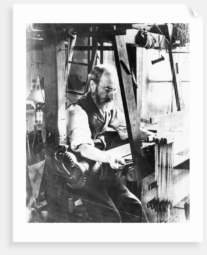 Man working at a handloom by English Photographer