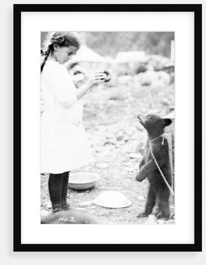 Girl and bear cub, c.1900-16 by Anonymous