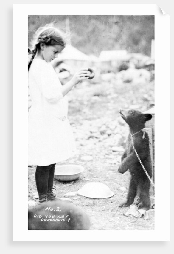 Girl and bear cub, c.1900-16 by Anonymous