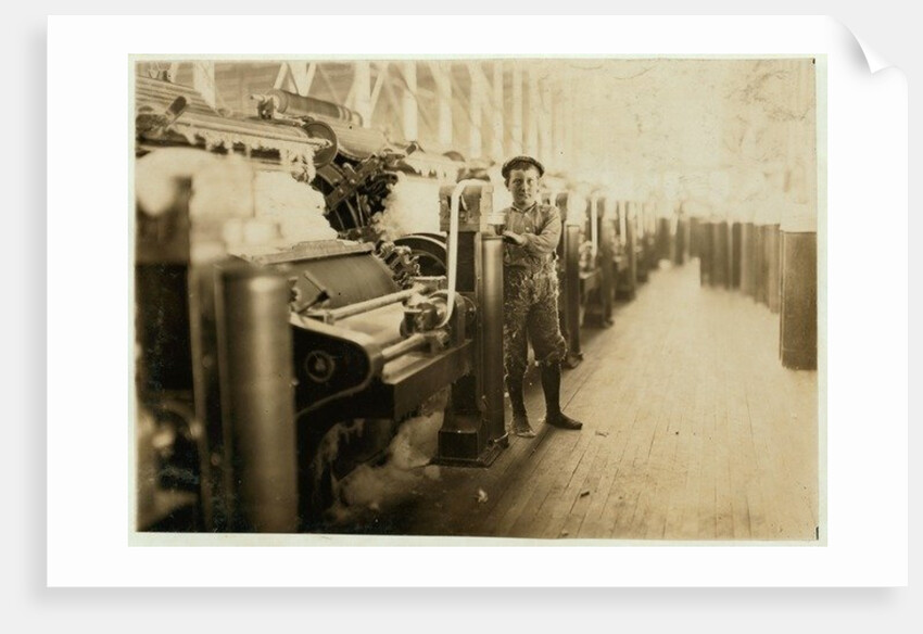 Boy sweeper by carding machines at Lincoln Cotton Mills, Evansville, Indiana in stockinged feet on a slippery floor, 1908 by Lewis Wickes Hine