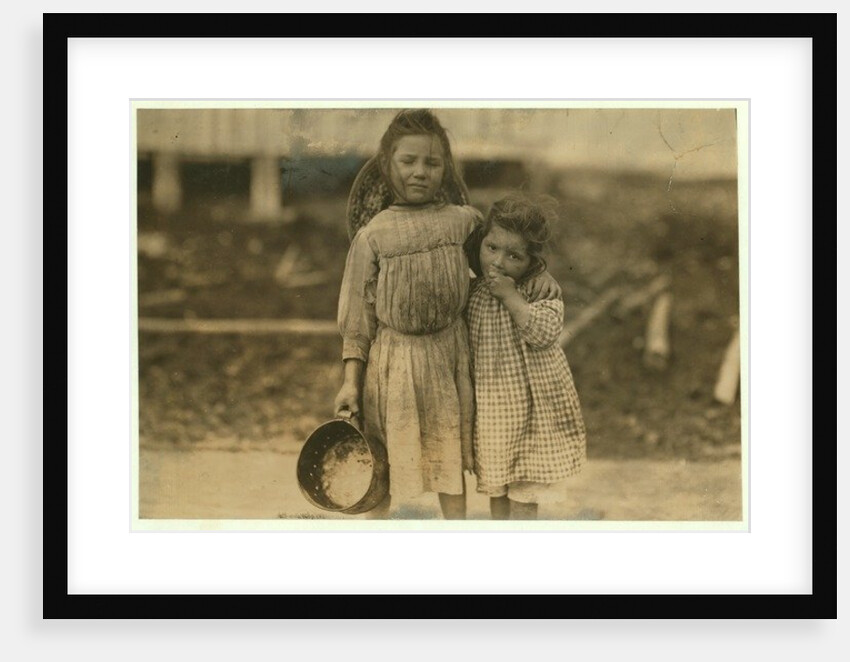 Maud and Grade Daly, 5 and 3 years old pick about a pot of shrimp each day for the Peerless Oyster Company, Bay St. Louis, Mississippi, 1911 by Lewis Wickes Hine
