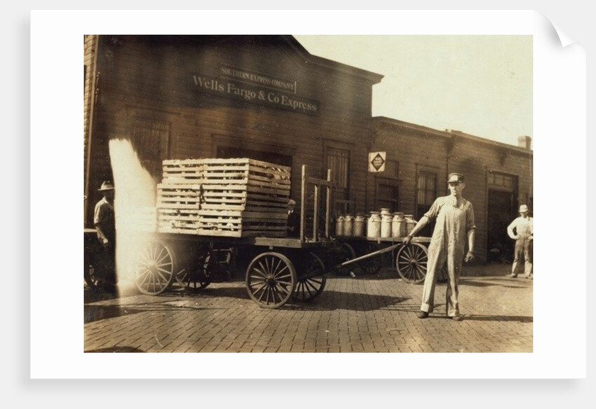 Men in front of a Wells Fargo & Co Express depot with crates and milk cans, Springfiled, Missouri, 1916 by Lewis Wickes Hine