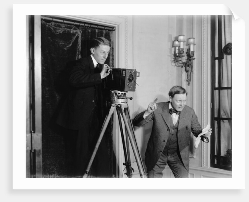 Two men using a movie camera indoors, c.1908-20 by Detroit Publishing Co.