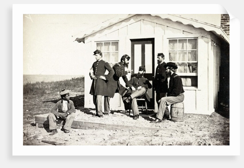 Five Civil War soldiers gathered on dirt porch outside home, African American youth seated near them, 1861-65 by American Photographer