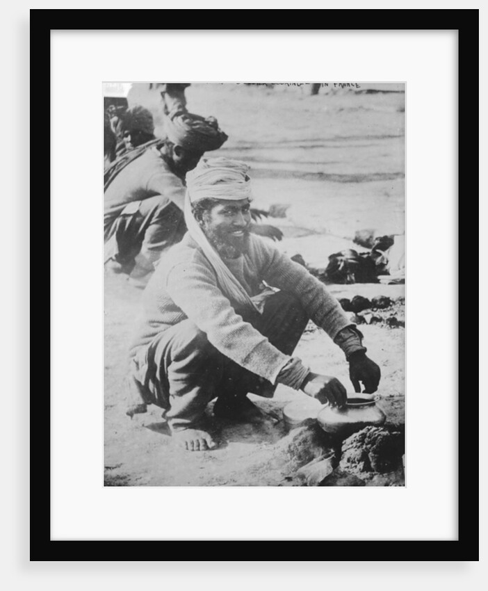 Indian soldier cooking in France, 1914-15 by French Photographer