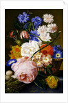 Roses, morning glory, narcissi, aster and other flowers in a basket, with eggs in a nest on a marble ledge, 1744 by Jan van Huysum