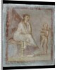 Framed vignette painted in fresco on a green wall: Cupid reveals the contents of a gilded box to a seated woman, 65-75 AD by Roman