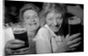Revellers at Josephine's Nightclub, Barkers Pool, Sheffield, UK. The girls are drinking Pils lager and blackcurrant cordial. 1992. by Bill Stephenson