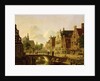 Dutch town scene with canal, figures and a church by Jan Hendrik Verheyen