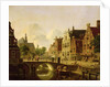 Dutch town scene with canal, figures and a church by Jan Hendrik Verheyen