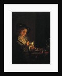 A candlelit interior with a young man seated at a table, lighting his pipe by Arnold Boonen