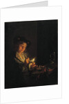 A candlelit interior with a young man seated at a table, lighting his pipe by Arnold Boonen