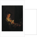A candlelit interior with a young man seated at a table, lighting his pipe by Arnold Boonen