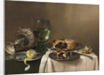 Pronk still life, with a roemer, an upturned silver tazza, a half-peeled lemon on a pewter plate, with a pie, a timepiece and a knife, 1631 by Willem Claesz. Heda