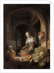 A maid preparing vegetables in a kitchen by Jan Adriansz van Staveren