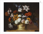 Tulips, snowballs and other flowers in a sculpted urn on a ledge by Pieter Casteels