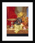 Grapes and a peach with a tazza on a table at a window by Edward Ladell