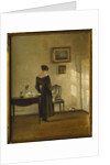 An Interior with a Woman feeding a Cat by Carl Holsoe