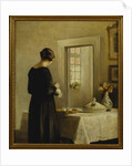 An Interior with a Woman at a Table by Carl Holsoe