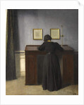 Ida Standing at a Desk, 1900 by Vilhelm Hammershoi