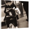 Woman reading on a subway with a Marilyn Monroe purse and an 'I Love New York' bag, 2004 by Anonymous