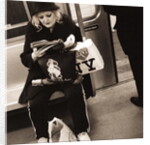 Woman reading on a subway with a Marilyn Monroe purse and an 'I Love New York' bag, 2004 by Anonymous
