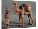 Funerary statuettes of a laden camel and a barbarian caravanner, Tang Dynasty by School Chinese
