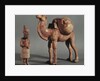 Funerary statuettes of a laden camel and a barbarian caravanner, Tang Dynasty by School Chinese