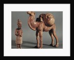 Funerary statuettes of a laden camel and a barbarian caravanner, Tang Dynasty by School Chinese