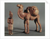 Funerary statuettes of a laden camel and a barbarian caravanner, Tang Dynasty by School Chinese