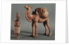 Funerary statuettes of a laden camel and a barbarian caravanner, Tang Dynasty by School Chinese