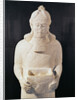 Statuette of a man carrying a box by Assyrian
