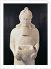 Statuette of a man carrying a box by Assyrian